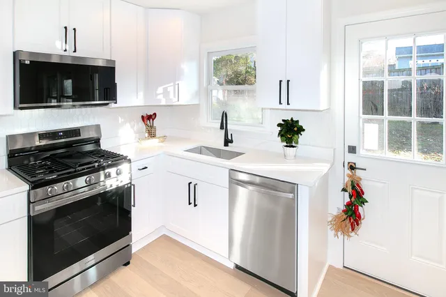 a kitchen with a stove and a microwave