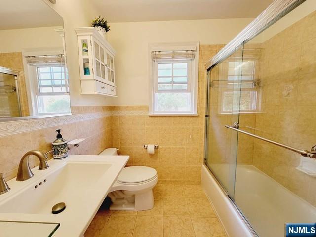 144 Valley Road Haworth, NJ 07641 - Photo 6 of 14 a bathroom with a sink a toilet and a bathtub
