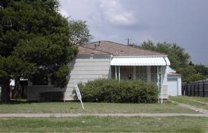 4009 South Tyler Street Amarillo, TX 79110 - Photo 1 of 1 a view of a backyard with potted plants and large tree