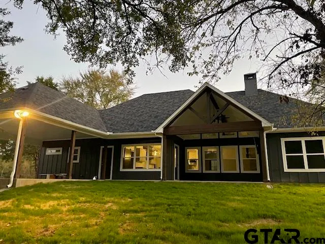 a bed room with a bed and a television