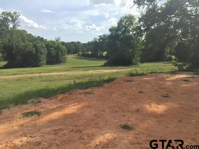 a bathroom with double sink and a mirror