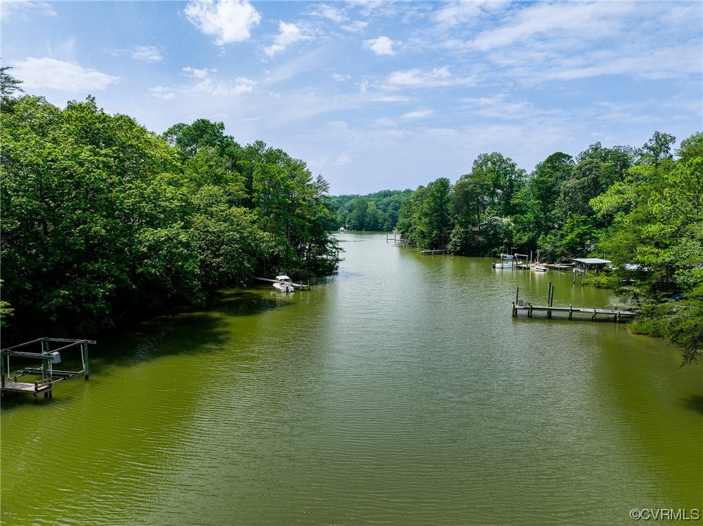 382 Hideaway Point Road Topping, VA 23169 - Photo 11 of 50 a view of a lake with houses in the back