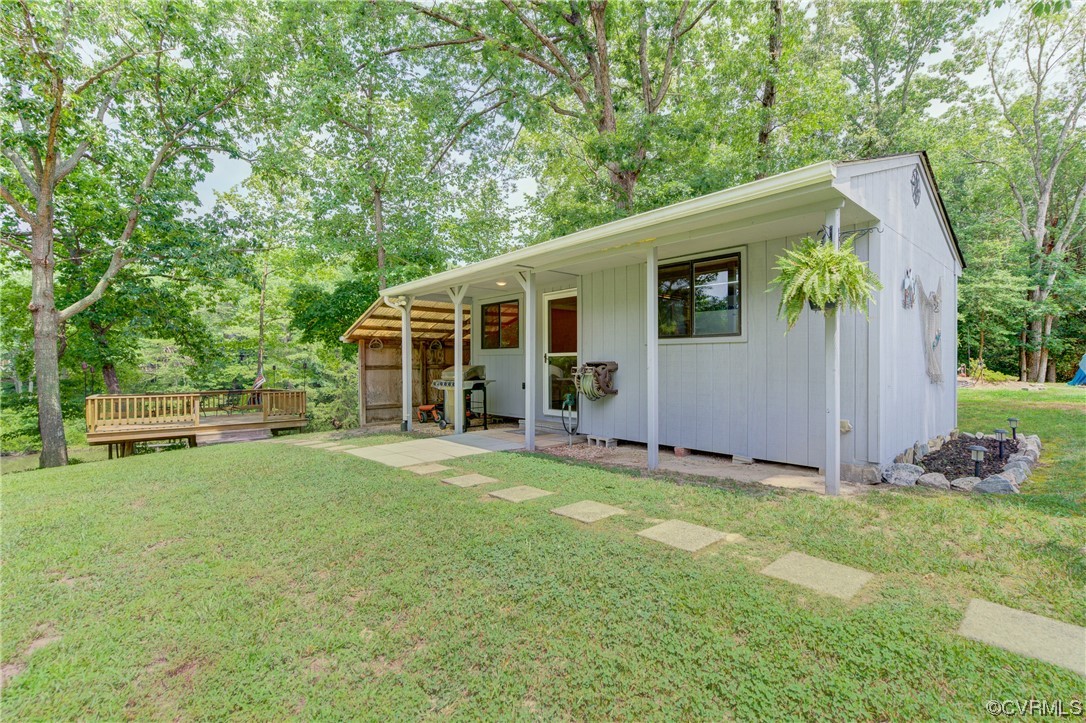 382 Hideaway Point Road Topping, VA 23169 - Photo 14 of 50 a view of a house with backyard and sitting area