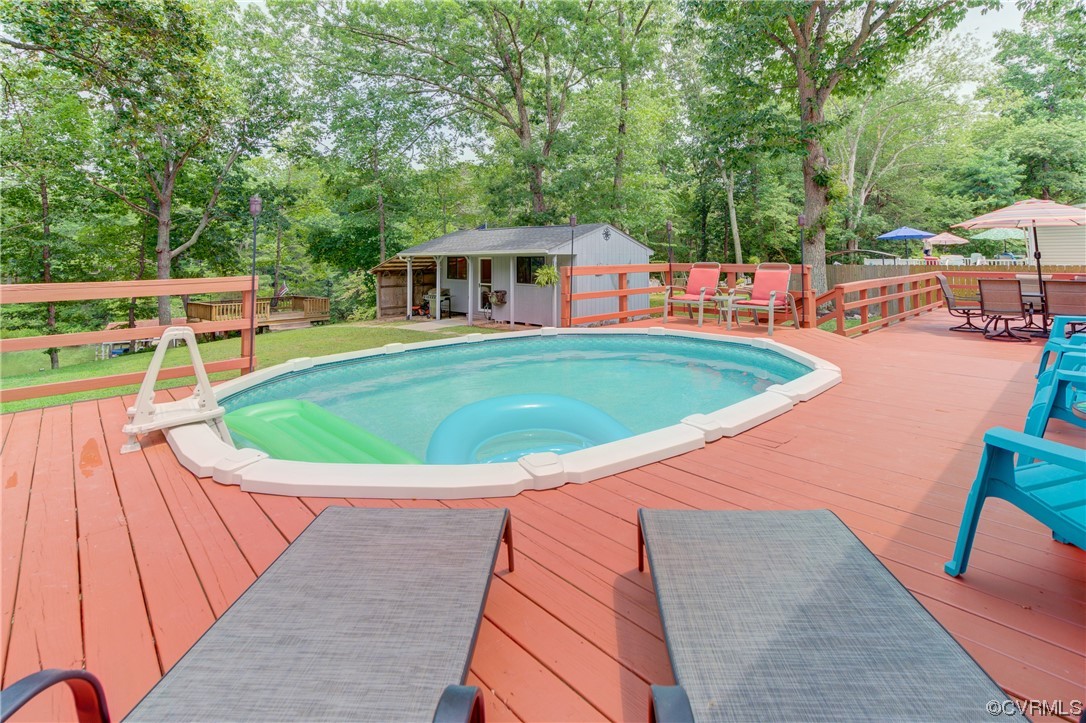 382 Hideaway Point Road Topping, VA 23169 - Photo 16 of 50 a view of a swimming pool with a patio