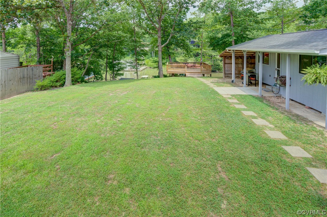 382 Hideaway Point Road Topping, VA 23169 - Photo 17 of 50 a view of a house with a backyard