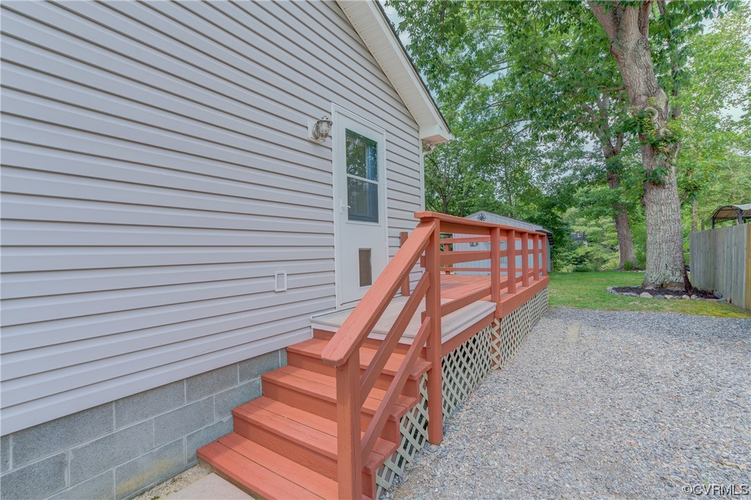 382 Hideaway Point Road Topping, VA 23169 - Photo 20 of 50 a view of a house with backyard and deck
