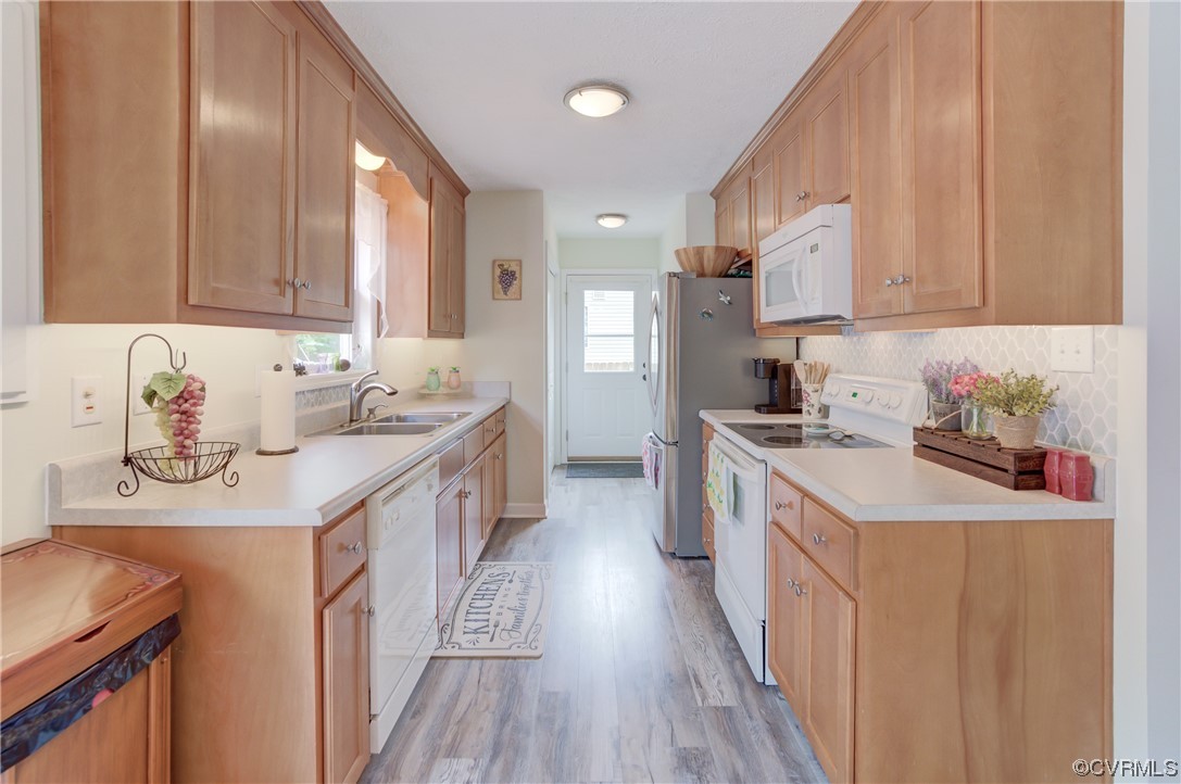 382 Hideaway Point Road Topping, VA 23169 - Photo 24 of 50 a kitchen with a sink stove top oven and cabinets