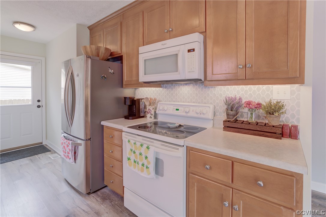 382 Hideaway Point Road Topping, VA 23169 - Photo 34 of 50 a kitchen with stainless steel appliances granite countertop a refrigerator and a stove top oven