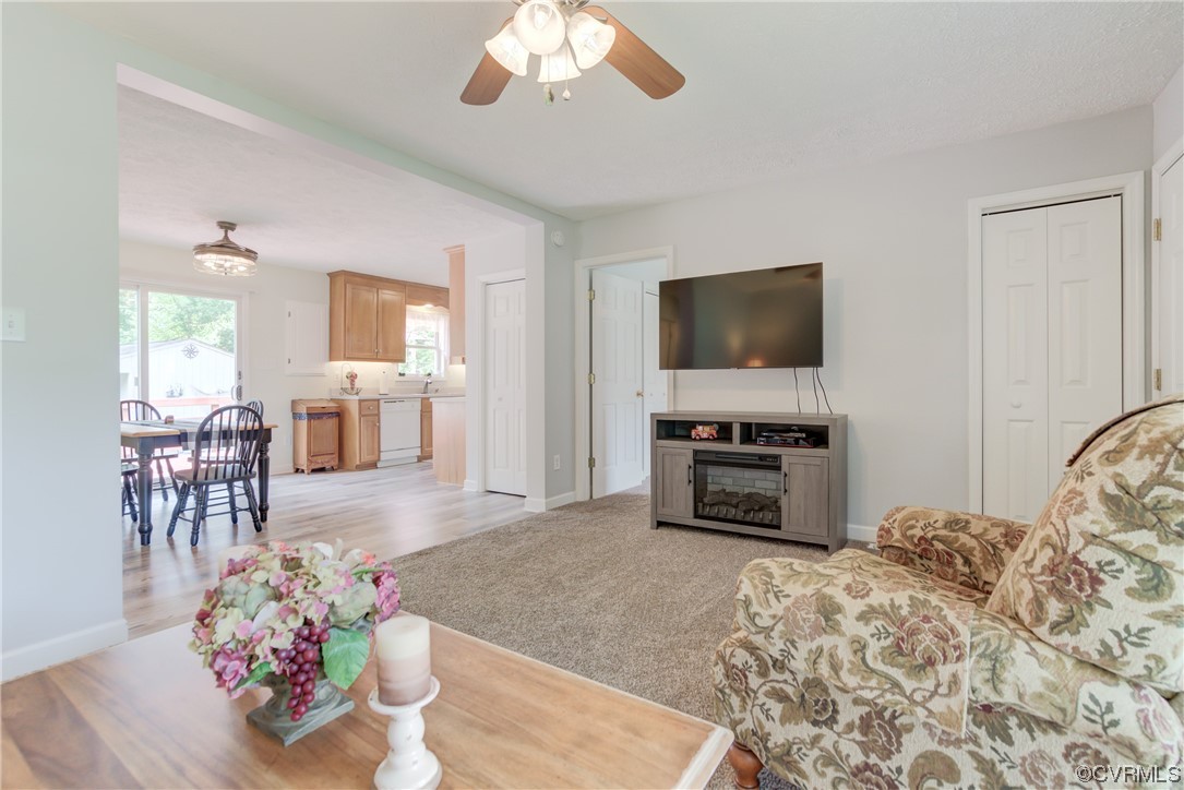382 Hideaway Point Road Topping, VA 23169 - Photo 38 of 50 a living room with furniture and a flat screen tv