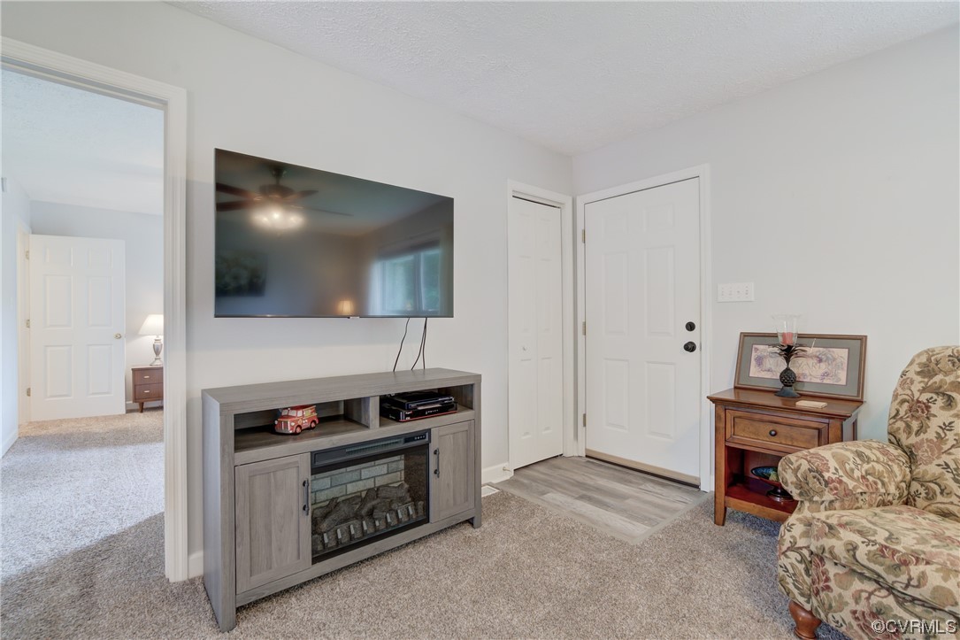 382 Hideaway Point Road Topping, VA 23169 - Photo 40 of 50 a living room with furniture and a flat screen tv
