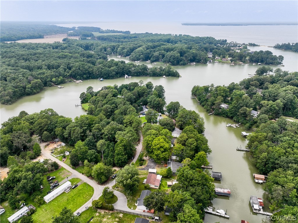 382 Hideaway Point Road Topping, VA 23169 - Photo 45 of 50 an aerial view of green landscape with trees houses and lake view