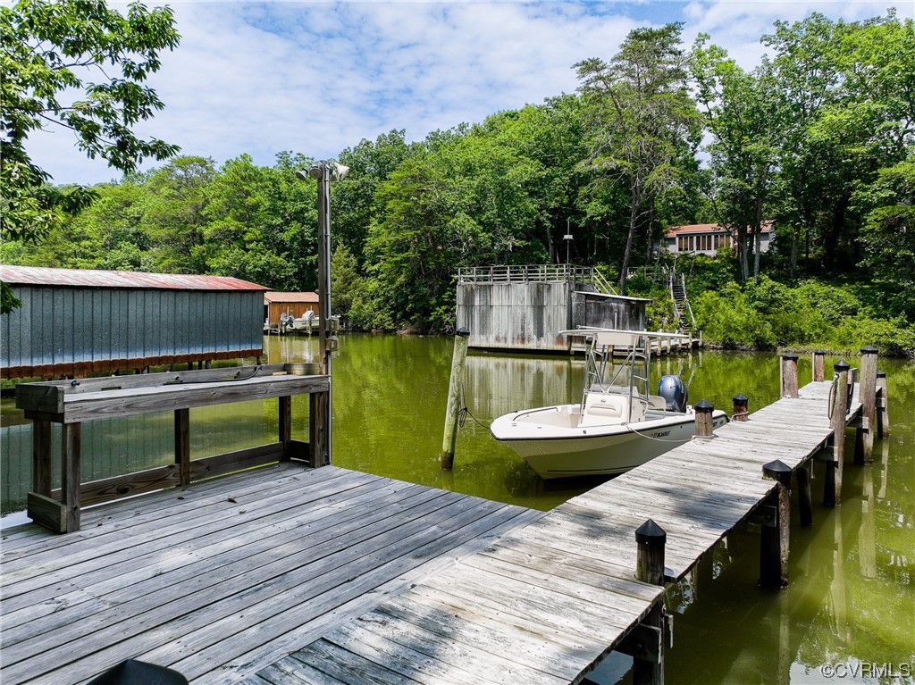 382 Hideaway Point Road Topping, VA 23169 - Photo 46 of 50 a view of a patio with swimming pool