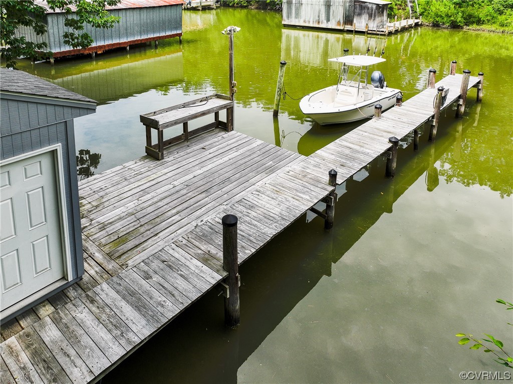 382 Hideaway Point Road Topping, VA 23169 - Photo 47 of 50 swimming pool with couple of relaxing chair