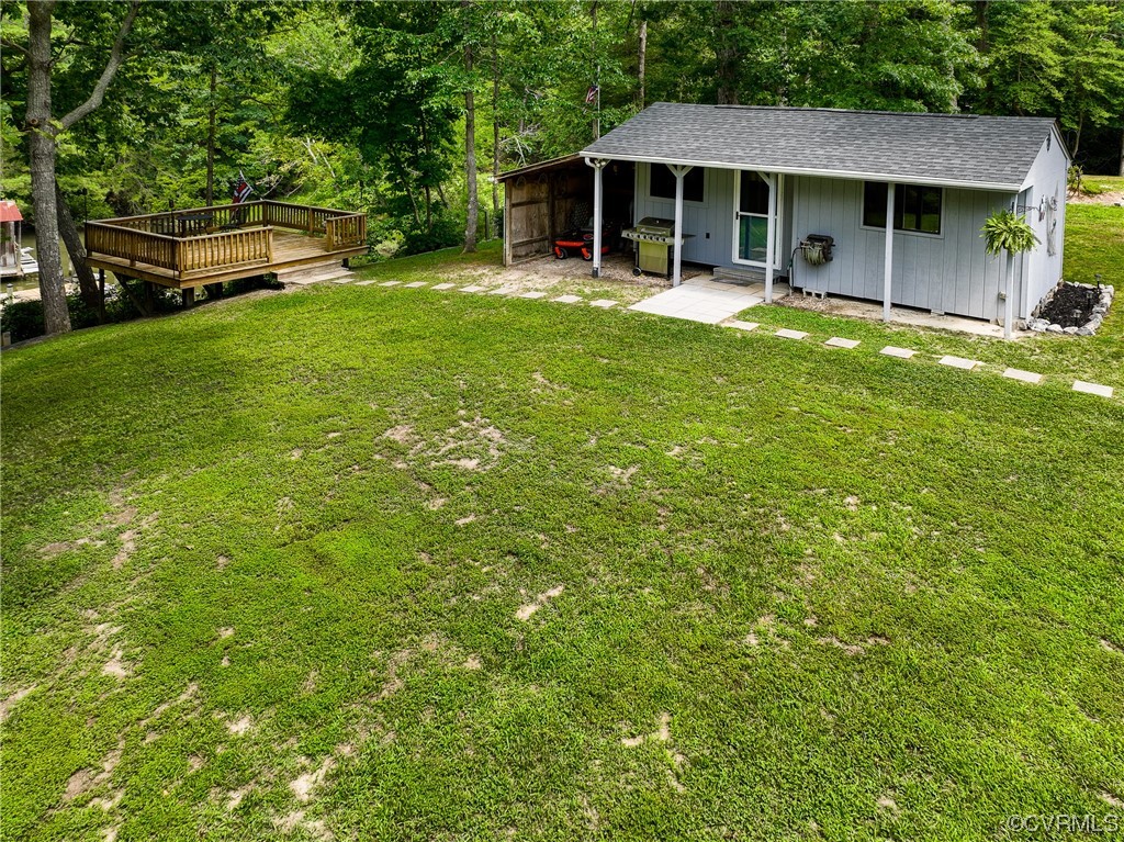 382 Hideaway Point Road Topping, VA 23169 - Photo 48 of 50 a view of an house with backyard space and balcony