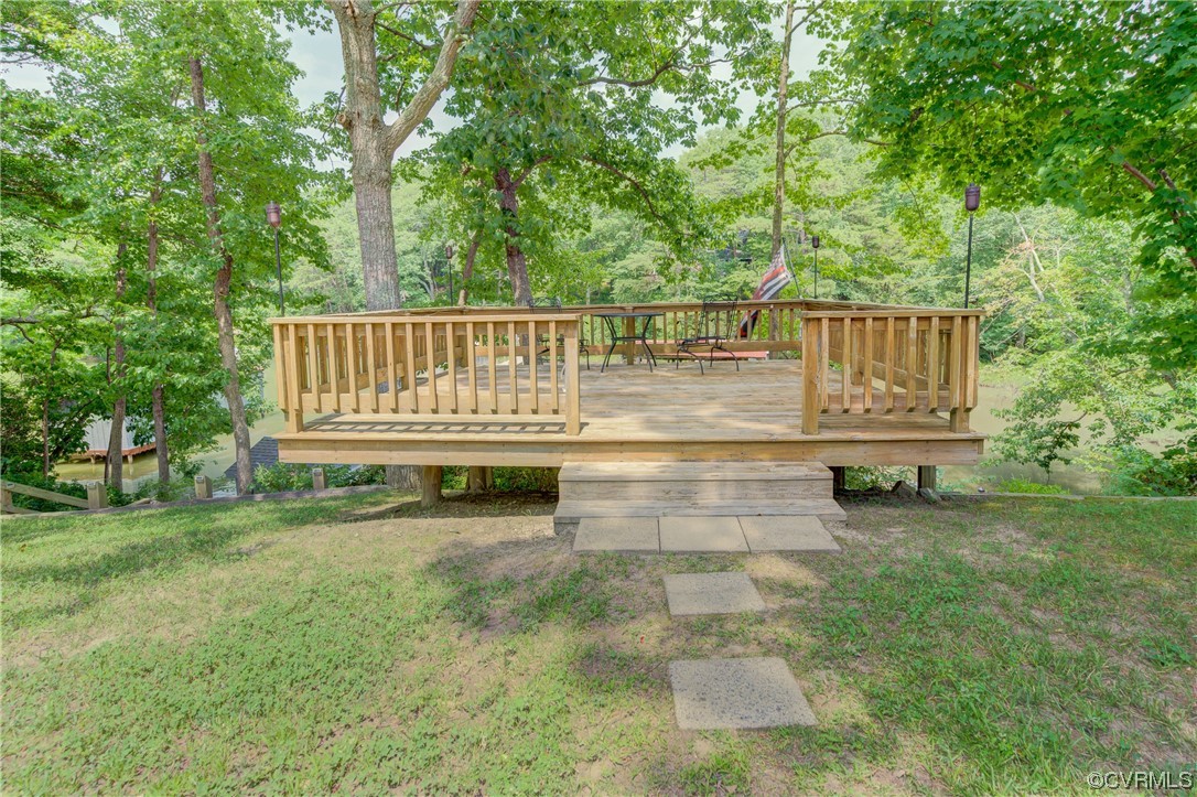 382 Hideaway Point Road Topping, VA 23169 - Photo 7 of 50 a view of a chair and tables in the yard