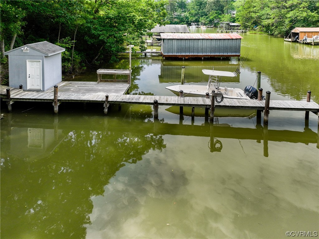 382 Hideaway Point Road Topping, VA 23169 - Photo 8 of 50 a view of a swimming pool with lounge chairs