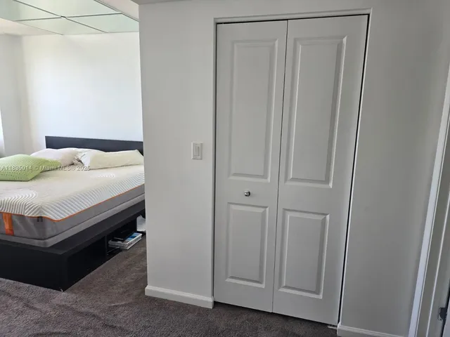 a bedroom with a bed and a table