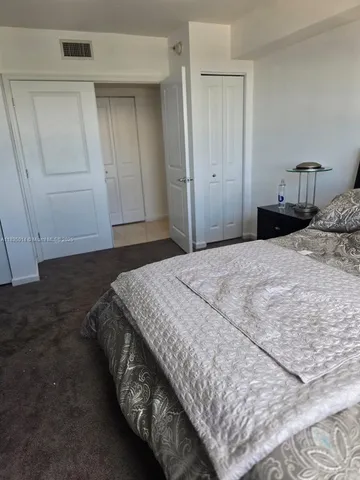 a view of a hallway with closet