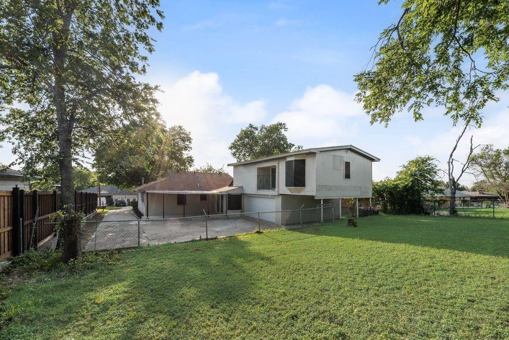 5706 Rocky Ridge Road Dallas, TX 75241 - Photo 25 of 31 a view of a house with a backyard and a patio