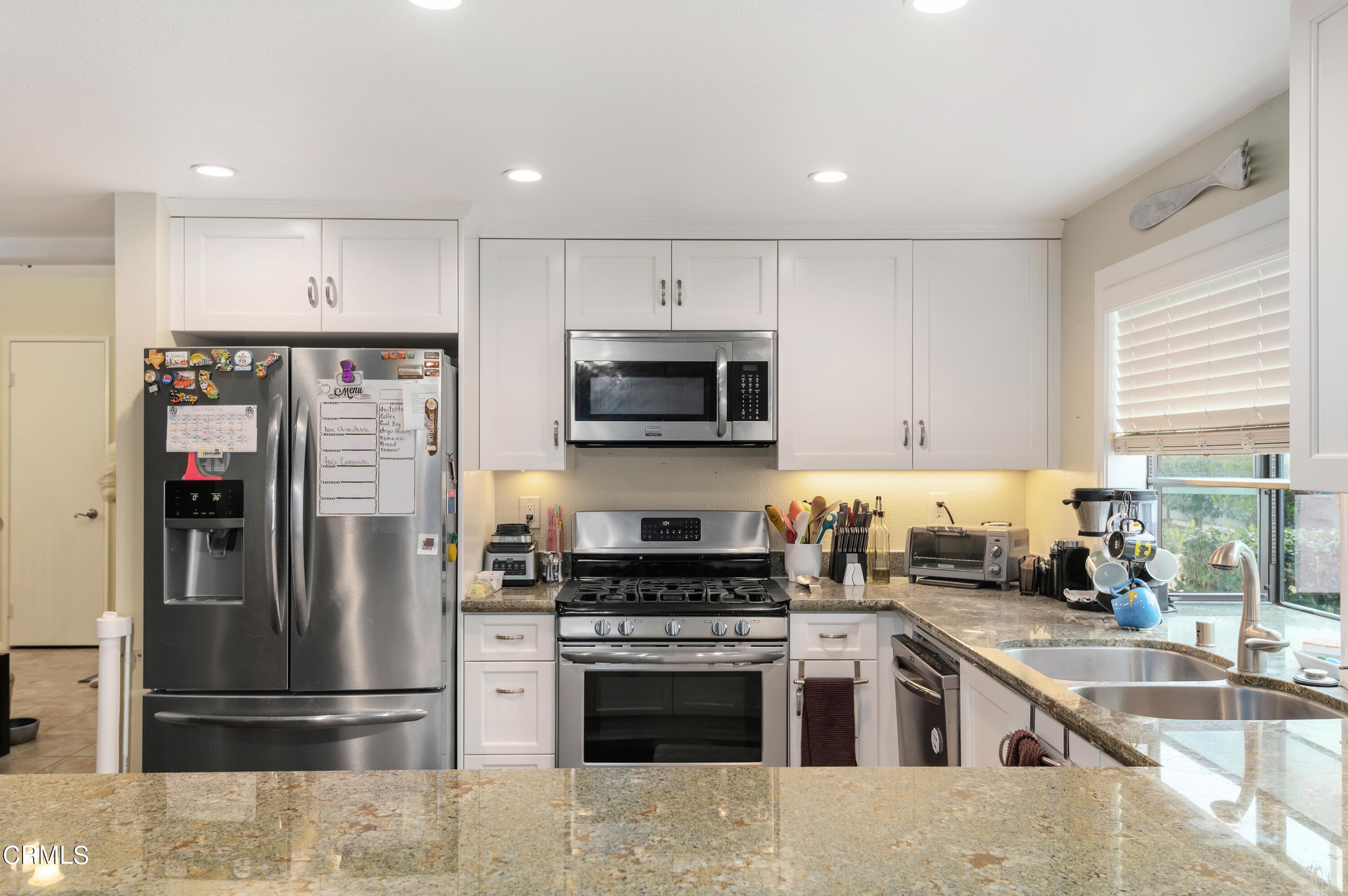 3550 Olds Road Oxnard, CA 93033 - Photo 10 of 26 a kitchen with a refrigerator and a sink