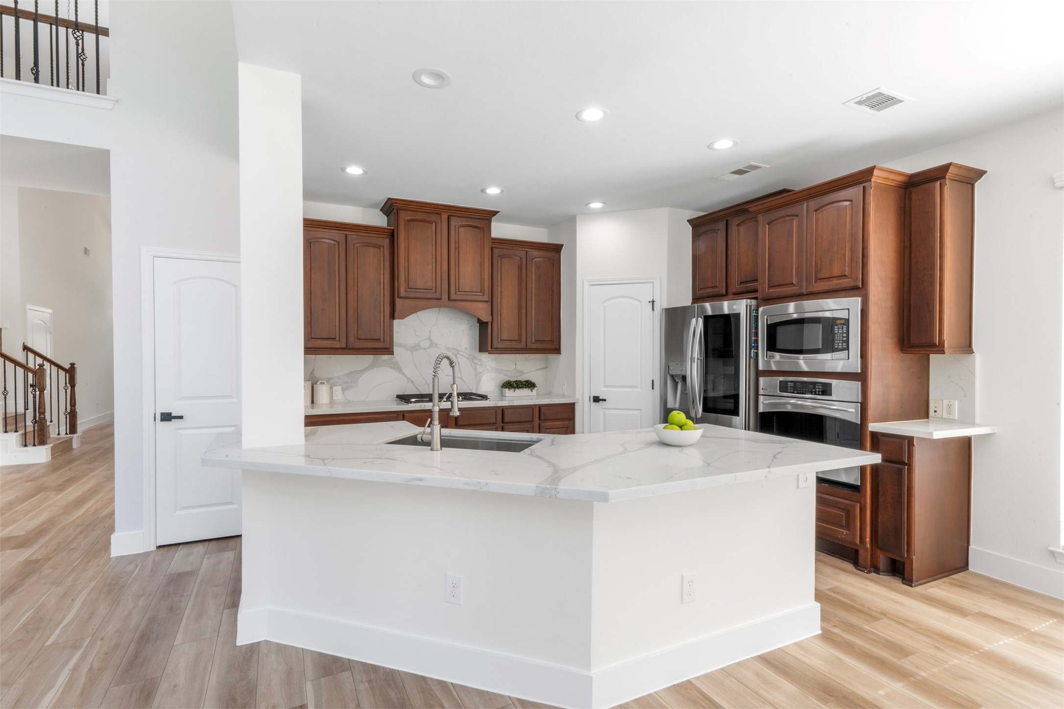26422 Red Cliff Ridge Katy, TX 77494 - Photo 40 of 40 No one is left out when you are in the kitchen with this open floor plan. Your back isn't to all the activities with the sink-in island!