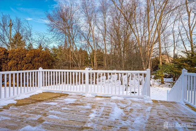 a view of a house with snow on the road