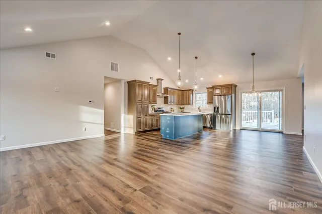 a view of kitchen with cabinets and wooden floor