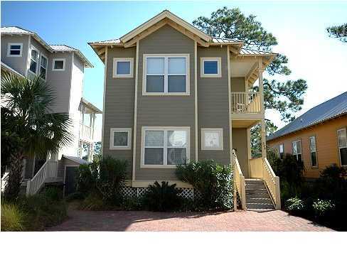 228 Hidden Lake Way Santa Rosa Beach, FL 32459 - Photo 1 of 11 a front view of a house with a garden