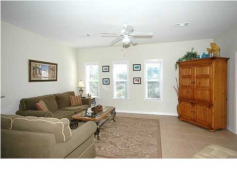 228 Hidden Lake Way Santa Rosa Beach, FL 32459 - Photo 2 of 11 a living room with furniture and wooden floor