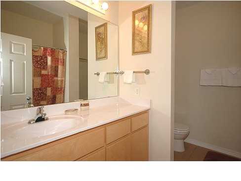 228 Hidden Lake Way Santa Rosa Beach, FL 32459 - Photo 6 of 11 a bathroom with a sink a toilet a mirror and shower