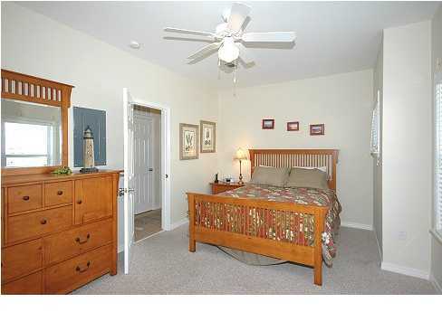 228 Hidden Lake Way Santa Rosa Beach, FL 32459 - Photo 9 of 11 a bedroom with a bed and a dresser