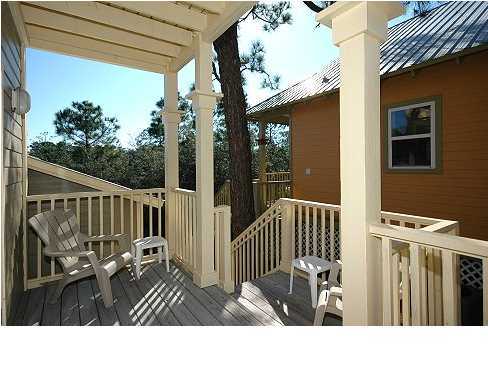 228 Hidden Lake Way Santa Rosa Beach, FL 32459 - Photo 10 of 11 a view of a balcony with wooden floor
