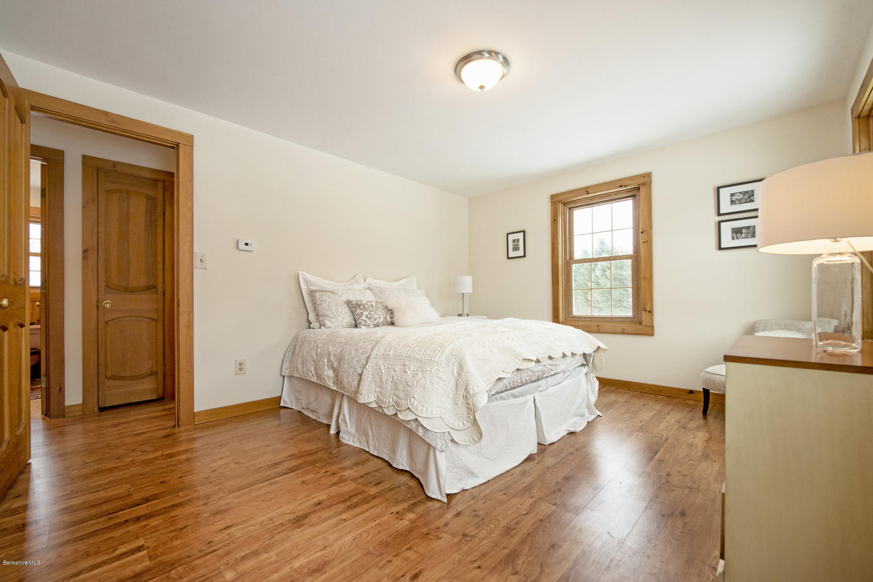 540 Main Road Monterey, MA 01245 - Photo 11 of 26 a bedroom with a bed and wooden floor