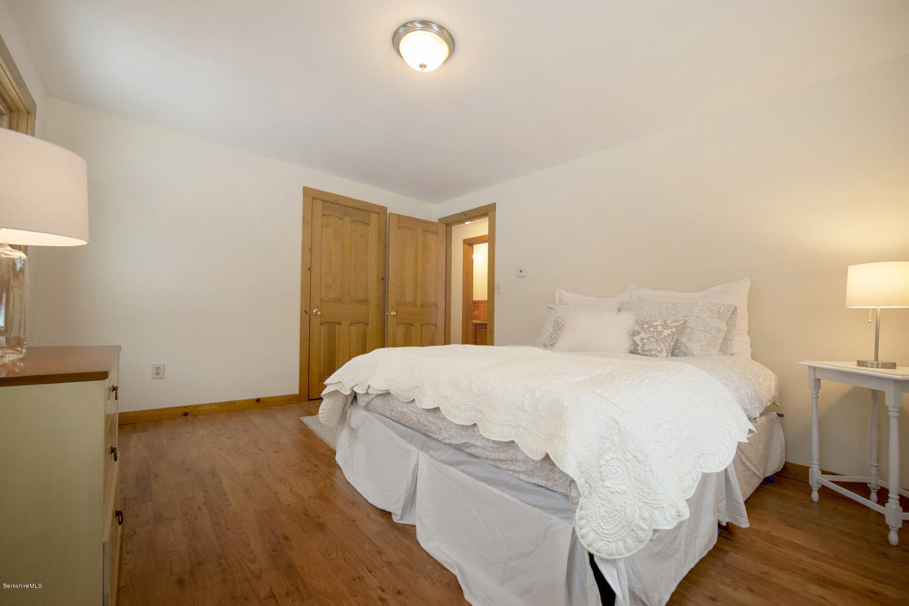 540 Main Road Monterey, MA 01245 - Photo 12 of 26 a bedroom with a bed and a lamp