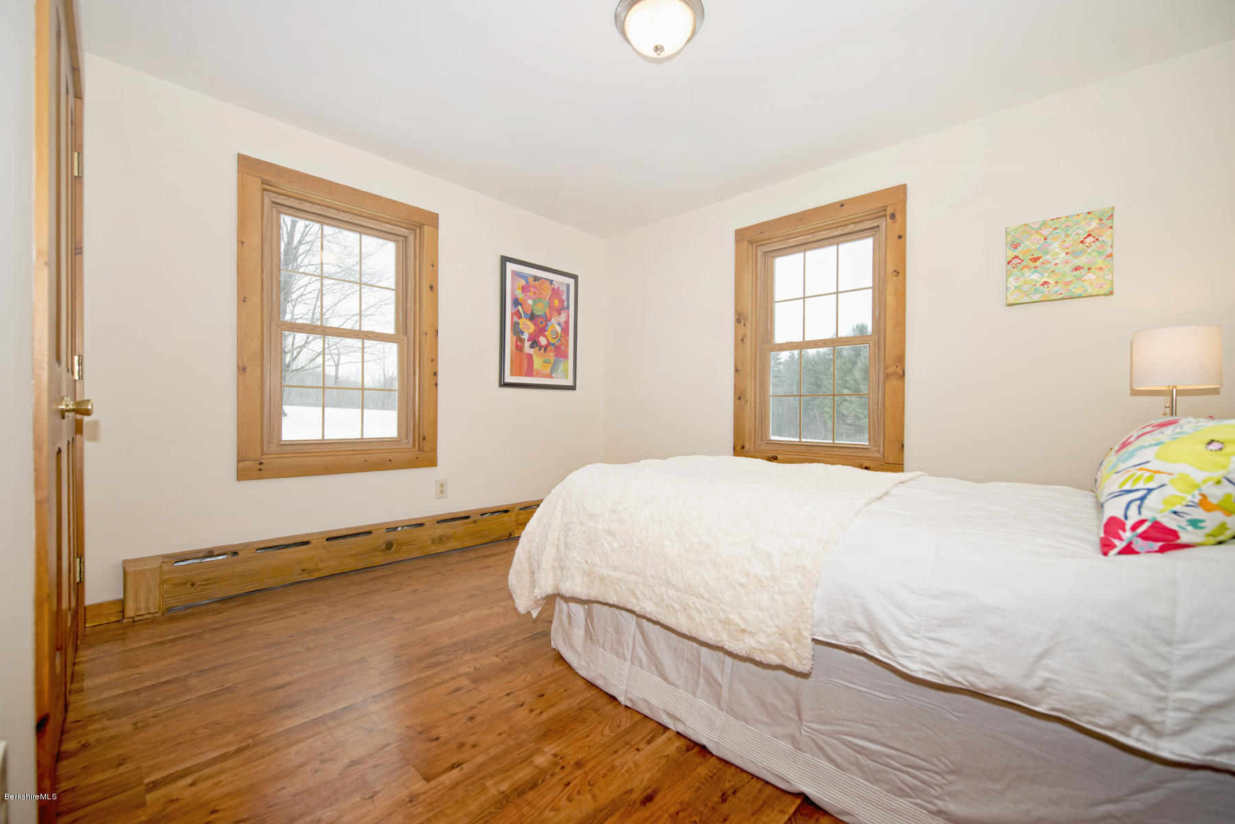 540 Main Road Monterey, MA 01245 - Photo 13 of 26 a bedroom with a bed and wooden floor