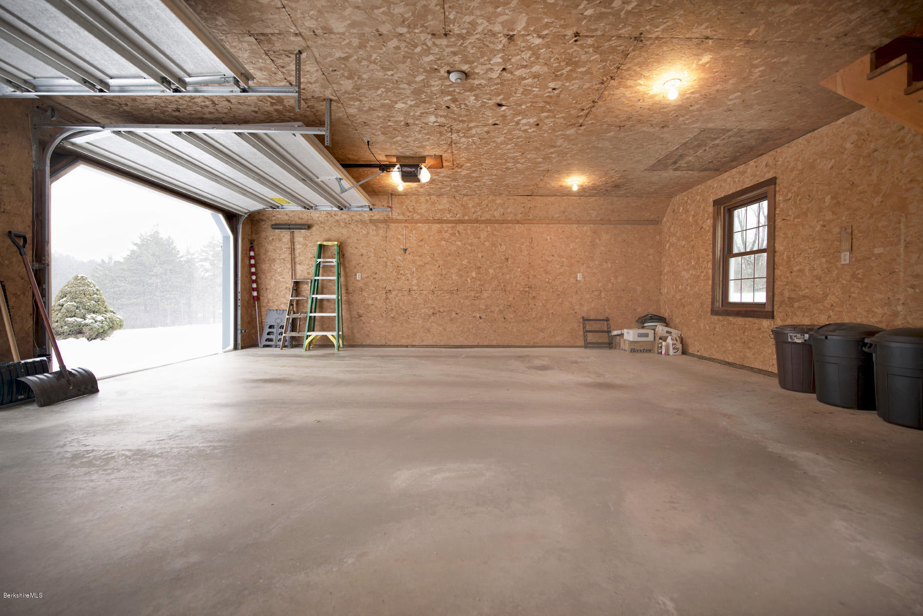 540 Main Road Monterey, MA 01245 - Photo 18 of 26 a view of empty room with wooden floor and windows
