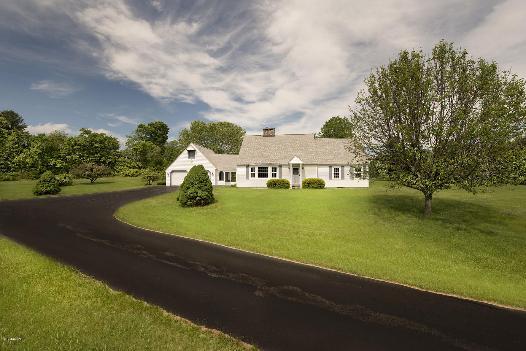 540 Main Road Monterey, MA 01245 - Photo 21 of 26 a view of a house with pool and trees in the background