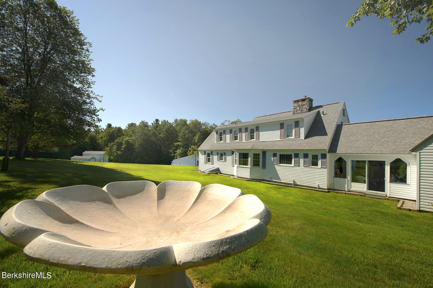 540 Main Road Monterey, MA 01245 - Photo 23 of 26 a view of a house with a swimming pool