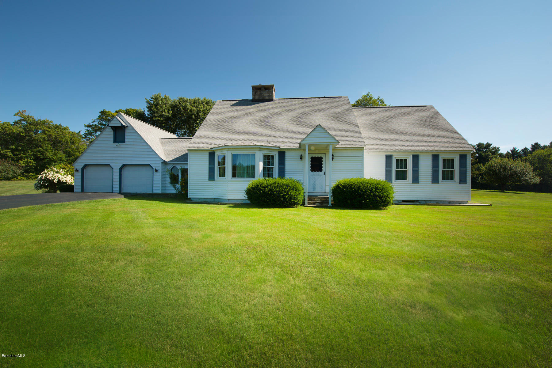 540 Main Road Monterey, MA 01245 - Photo 5 of 26 a front view of house with yard and green space