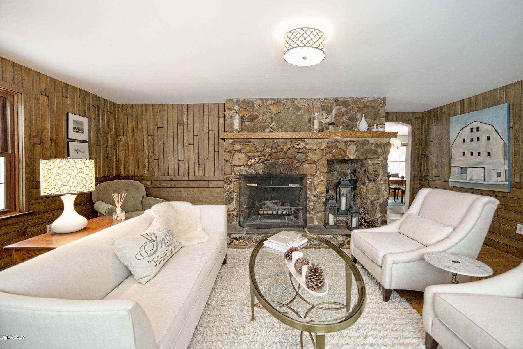 540 Main Road Monterey, MA 01245 - Photo 7 of 26 a living room with furniture a fireplace and a table