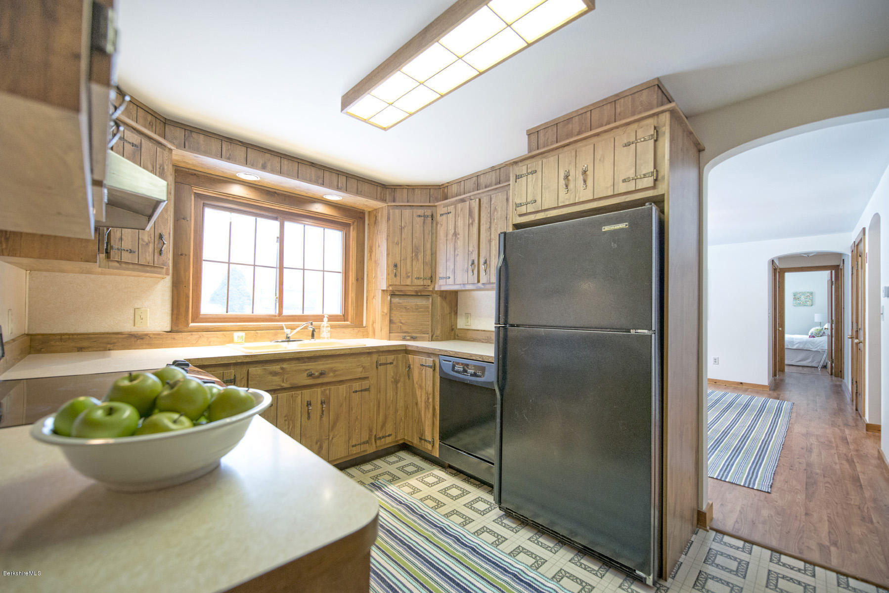540 Main Road Monterey, MA 01245 - Photo 9 of 26 a kitchen with stainless steel appliances granite countertop a refrigerator a sink a window and dining table