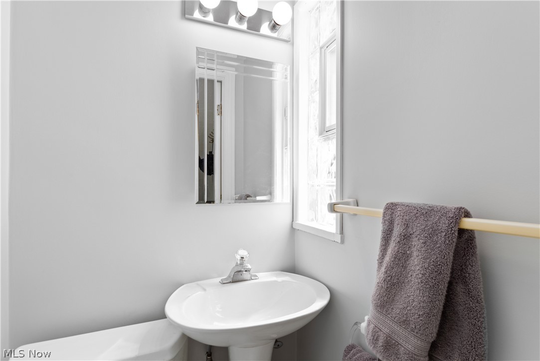 3439 Helen Road Shaker Heights, OH 44122 - Photo 22 of 24 Updated powder room off kitchen with pedestal sink