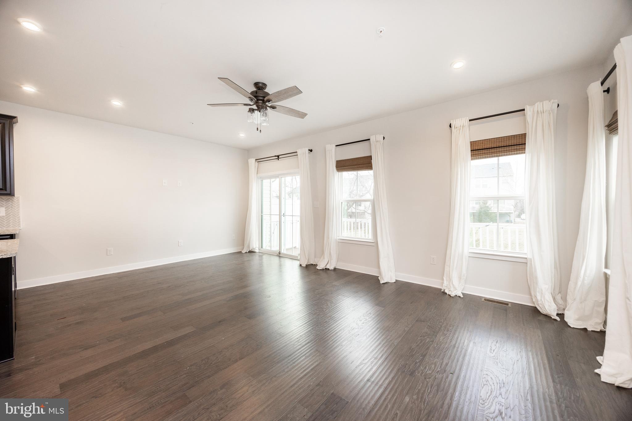 131 Mulberry Drive Malvern, PA 19355 - Photo 11 of 37 a view of an empty room with wooden floor and a window