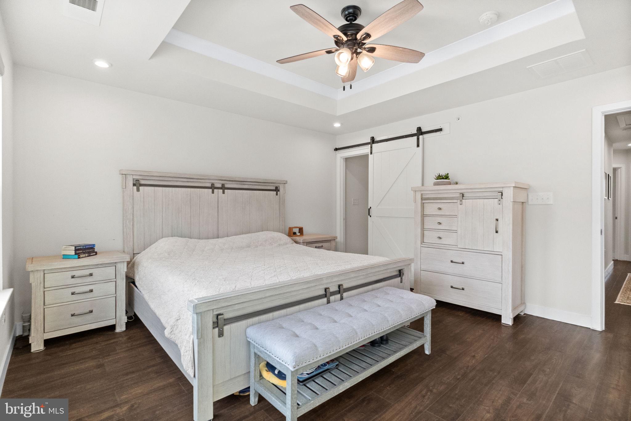 131 Mulberry Drive Malvern, PA 19355 - Photo 15 of 37 a bedroom with a bed and a chandelier