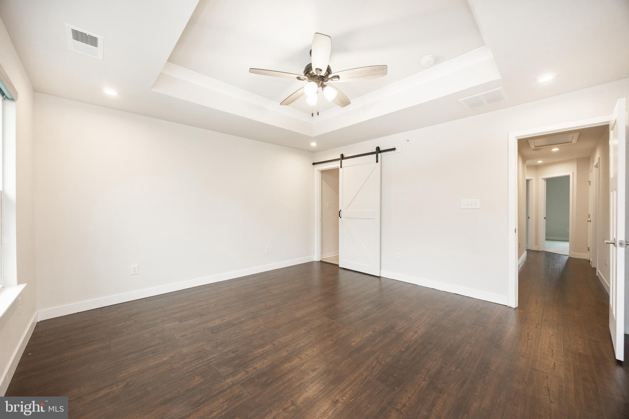 131 Mulberry Drive Malvern, PA 19355 - Photo 16 of 37 an empty room with wooden floor and ceiling fan