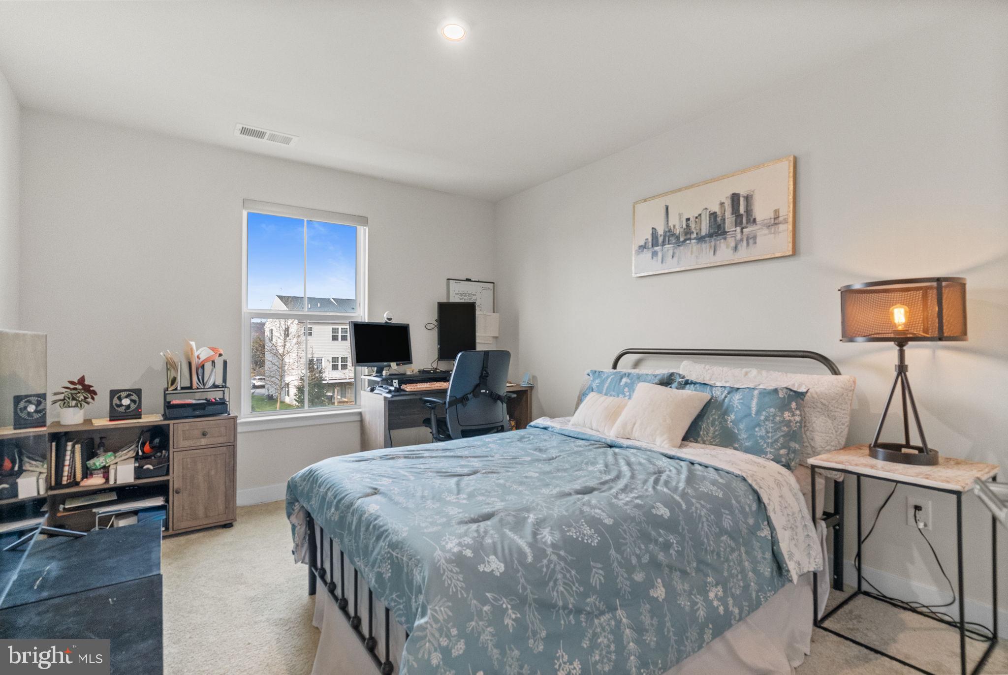 131 Mulberry Drive Malvern, PA 19355 - Photo 21 of 37 a bedroom with a bed a table and chair