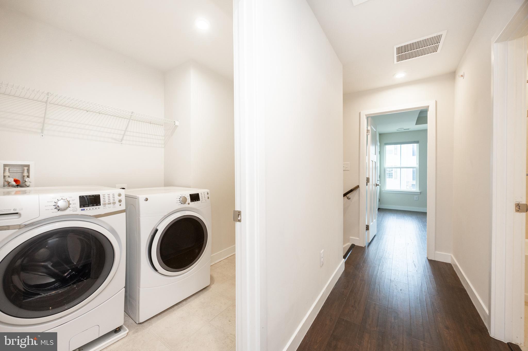 131 Mulberry Drive Malvern, PA 19355 - Photo 22 of 37 a view of a hallway with washer and dryer