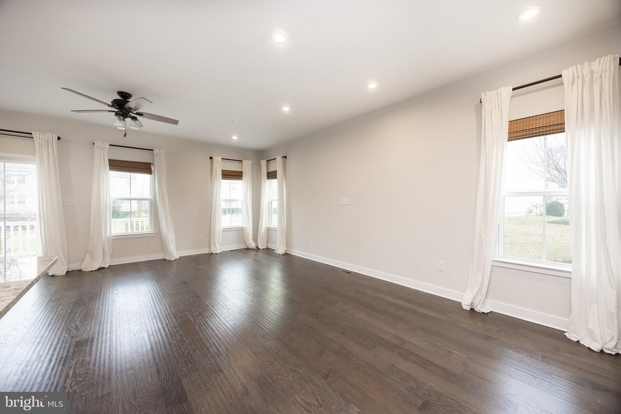 131 Mulberry Drive Malvern, PA 19355 - Photo 9 of 37 a view of an empty room with wooden floor and a window