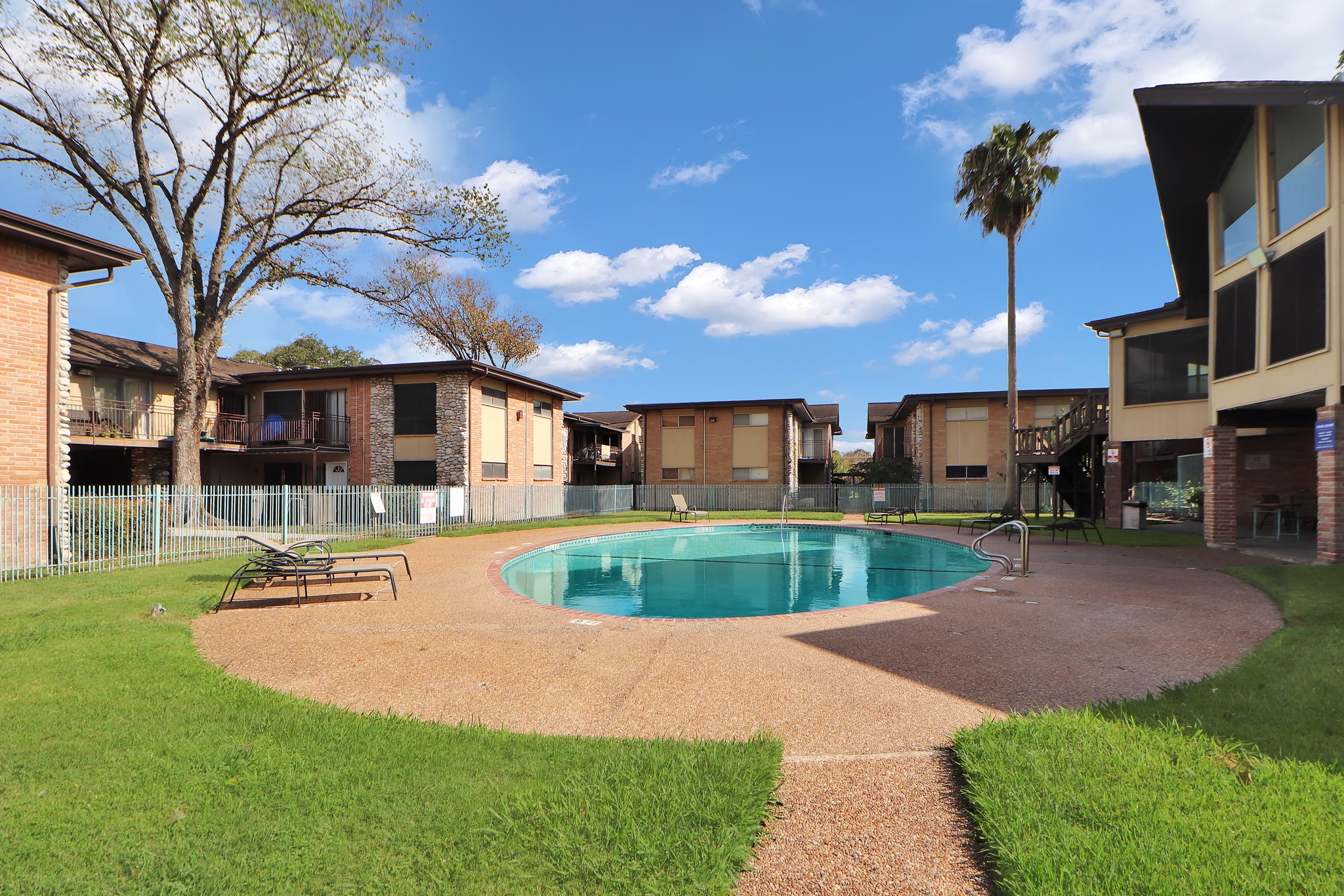 7047 Bissonnet Street, Unit 117 Houston, TX 77074 - Photo 16 of 17 a view of a house with a swimming pool
