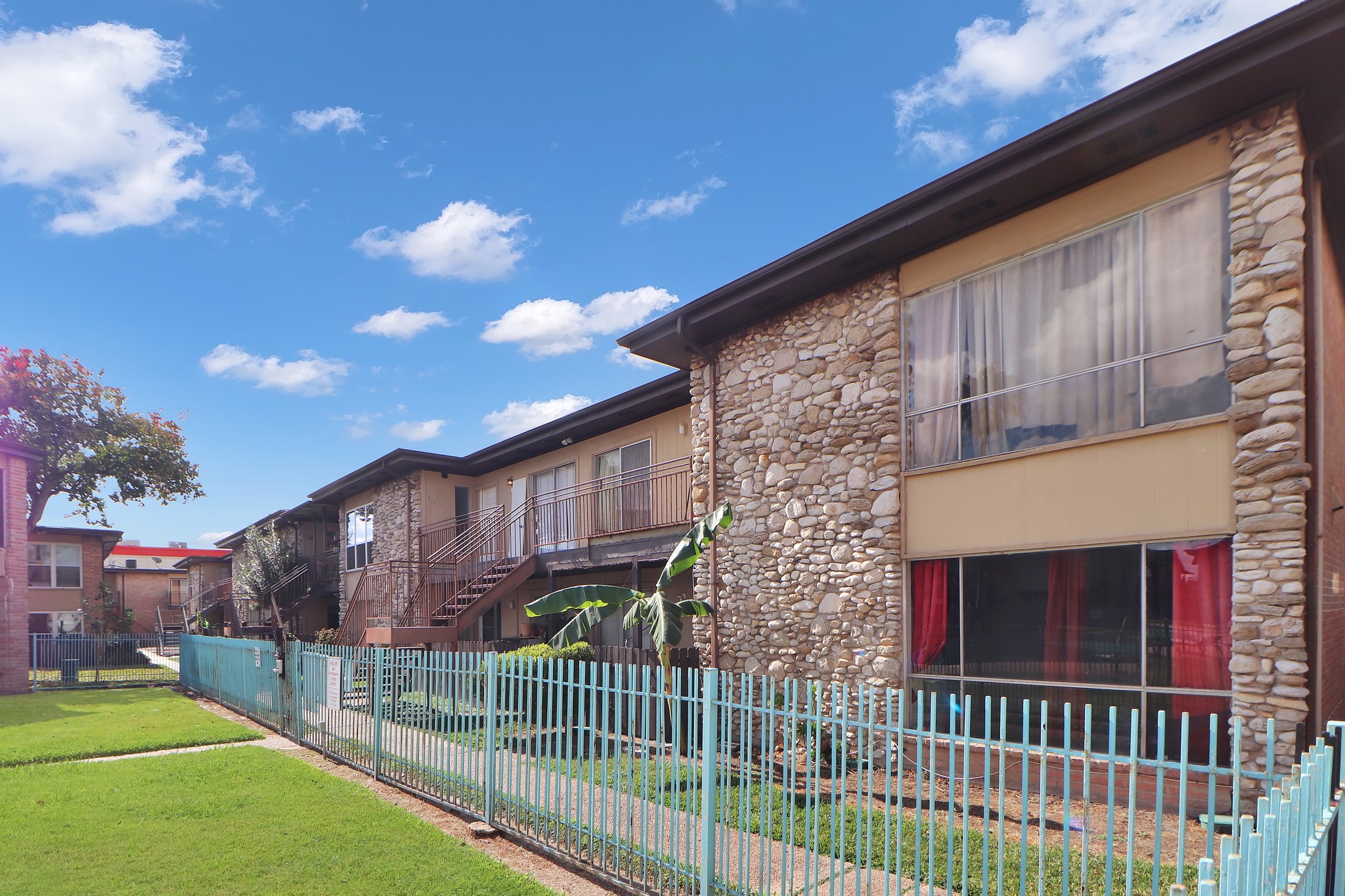 7047 Bissonnet Street, Unit 117 Houston, TX 77074 - Photo 17 of 17 a view of a house with a yard